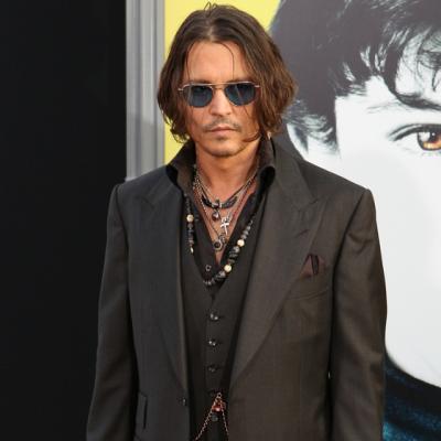 Johnny Depp, parasit de iubita pentru o femeie!